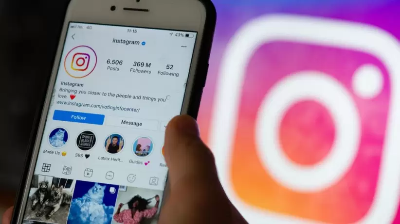 https___specials-images.forbesimg.com_imageserve_612e5ccf0c959a143f13998c_a-hand-holding-an-iphone-displaying-instagram--with-an-instagram-logo-in-the