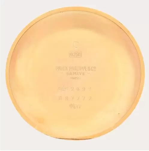 Fondo de caja, con sello de oro de 18 quilates, firma Patek Philippe & Co, número de referencia 2499, caja número 687.772 y, finalmente, la marca del